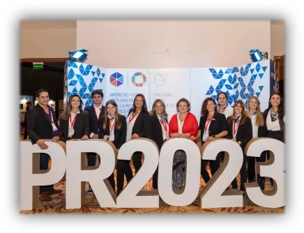 Team in front of the PR2023 letters